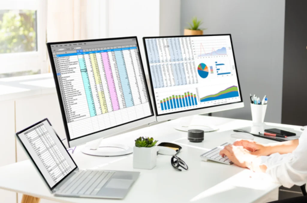 computer screens displaying time tracking spreadsheets vs software side by side